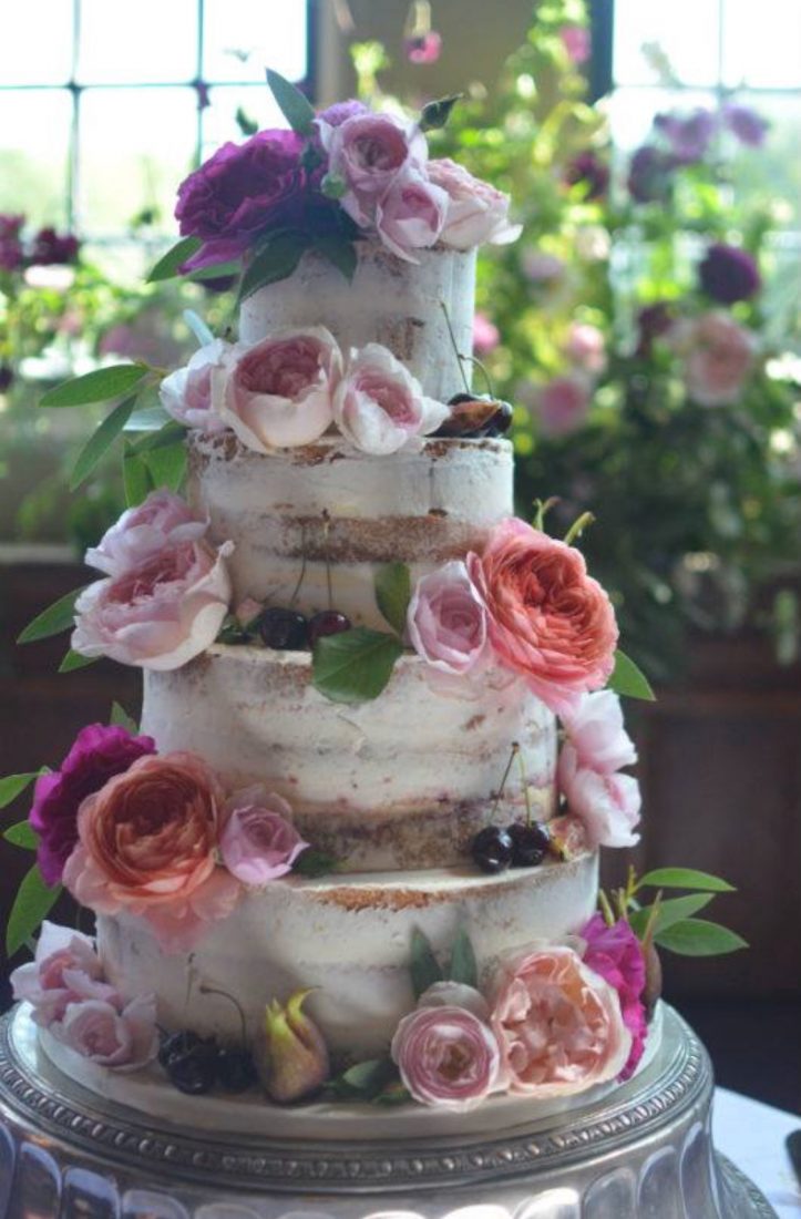 Close up of semi-naked wedding cake at Rhinefield House