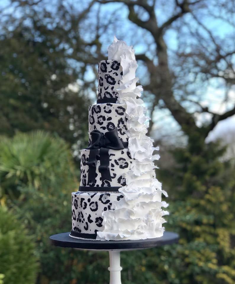 Leopard & ruffles wedding cake displayed in Michael Matthews Jewellers shop Bournemouth