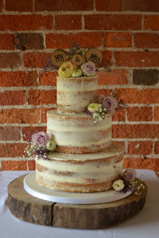 Semi naked wedding cake at Sopley Mill