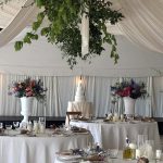 Four tier white wrapped effect wedding cake at Pylewell Park