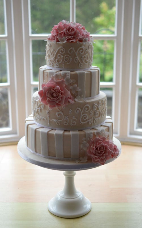 Ivory and white stripes with pink sugar roses.