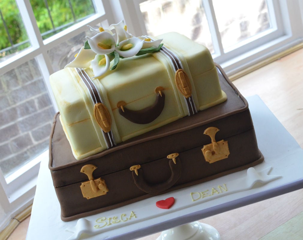 Suitcases wedding cake at The Tudor Grange Hotel