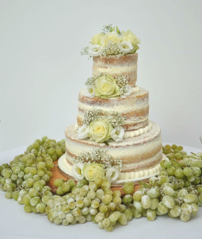 Semi naked wedding cake with frosted grapes at Pennsylvanian Castle
