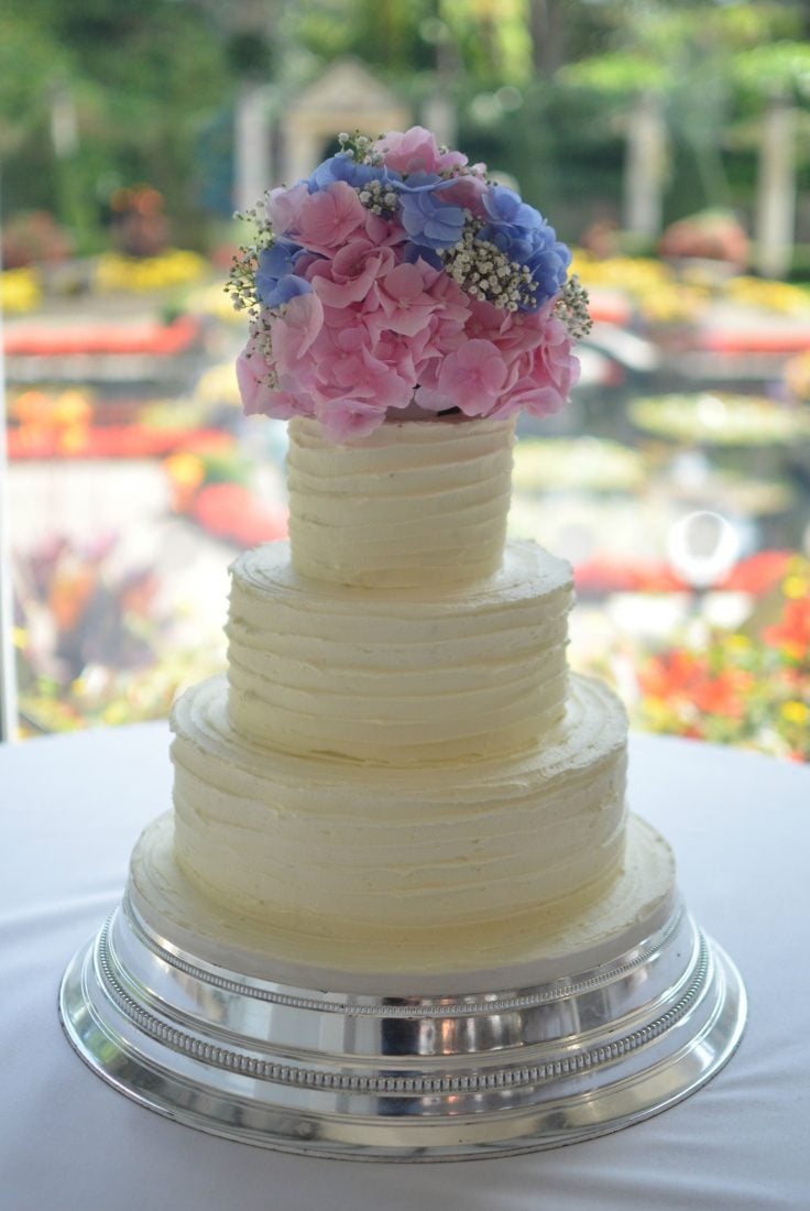 Buttercream coated carrot cake at Italian Villa. Flowers by Hillview florist.