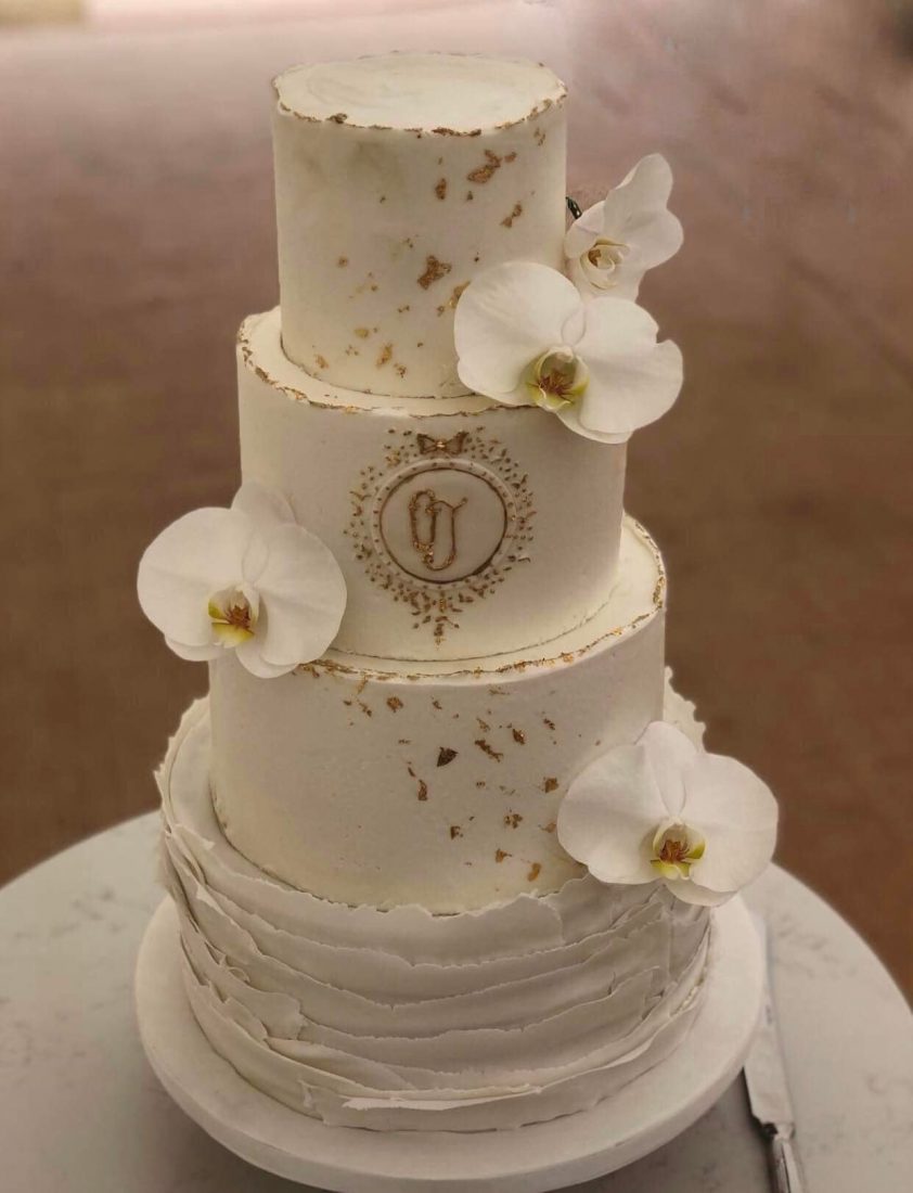 Gold & white wedding cake at Came House Dorchester
