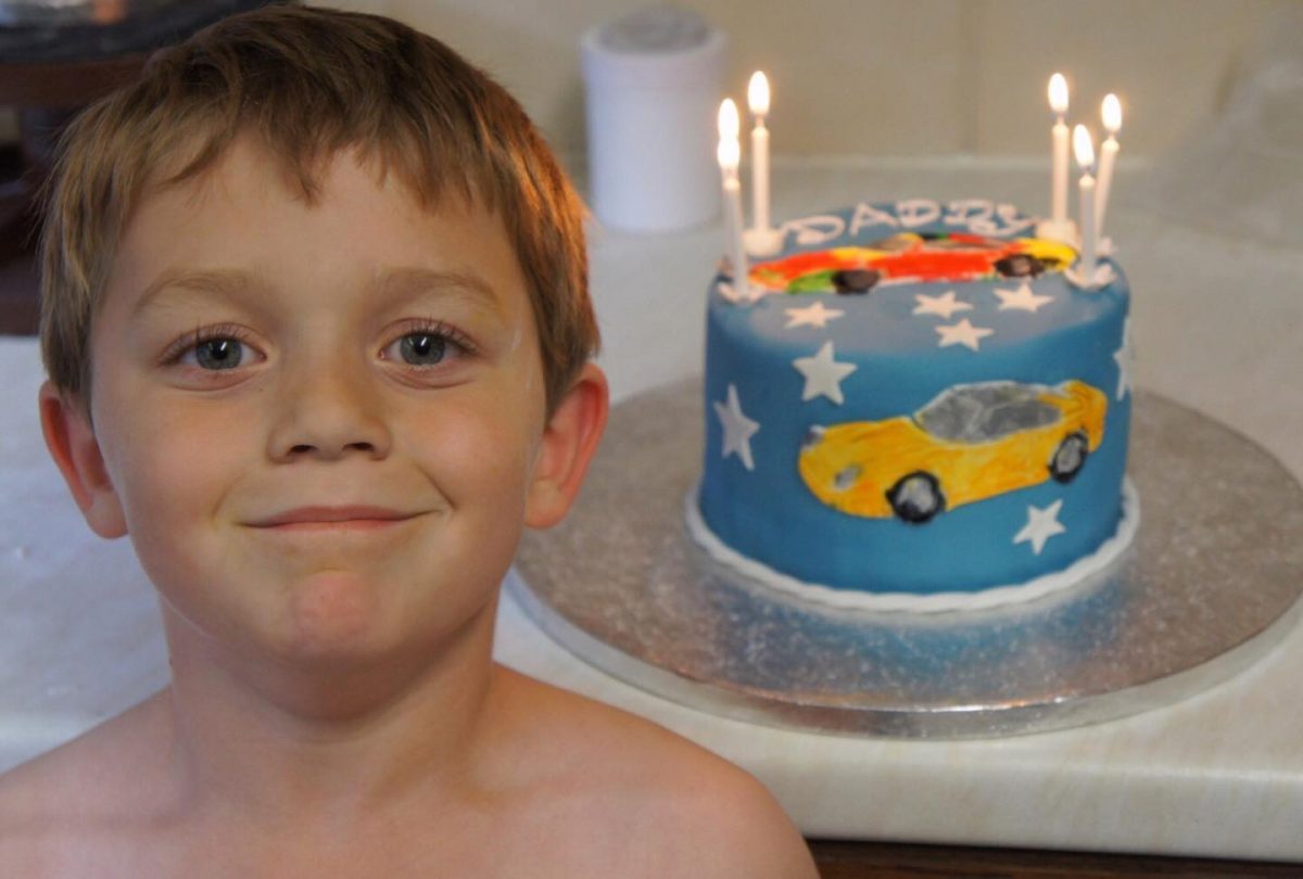 My young son feeling proud making his dads cake. 2012