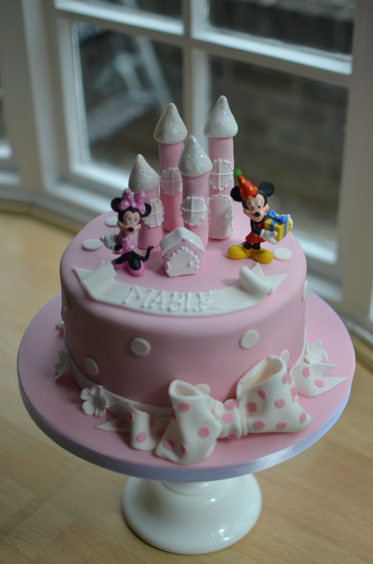 Pink Minnie Mouse castle cake